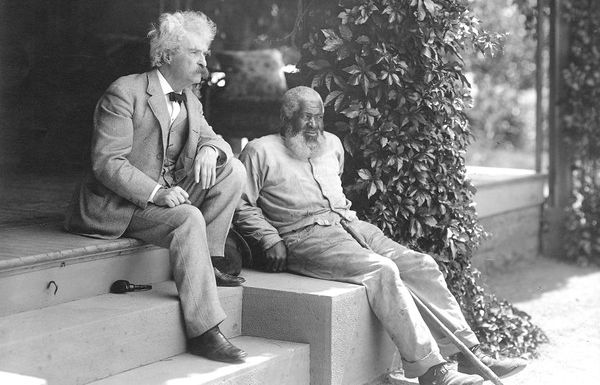 Mark Twain sits with John T. Lewis