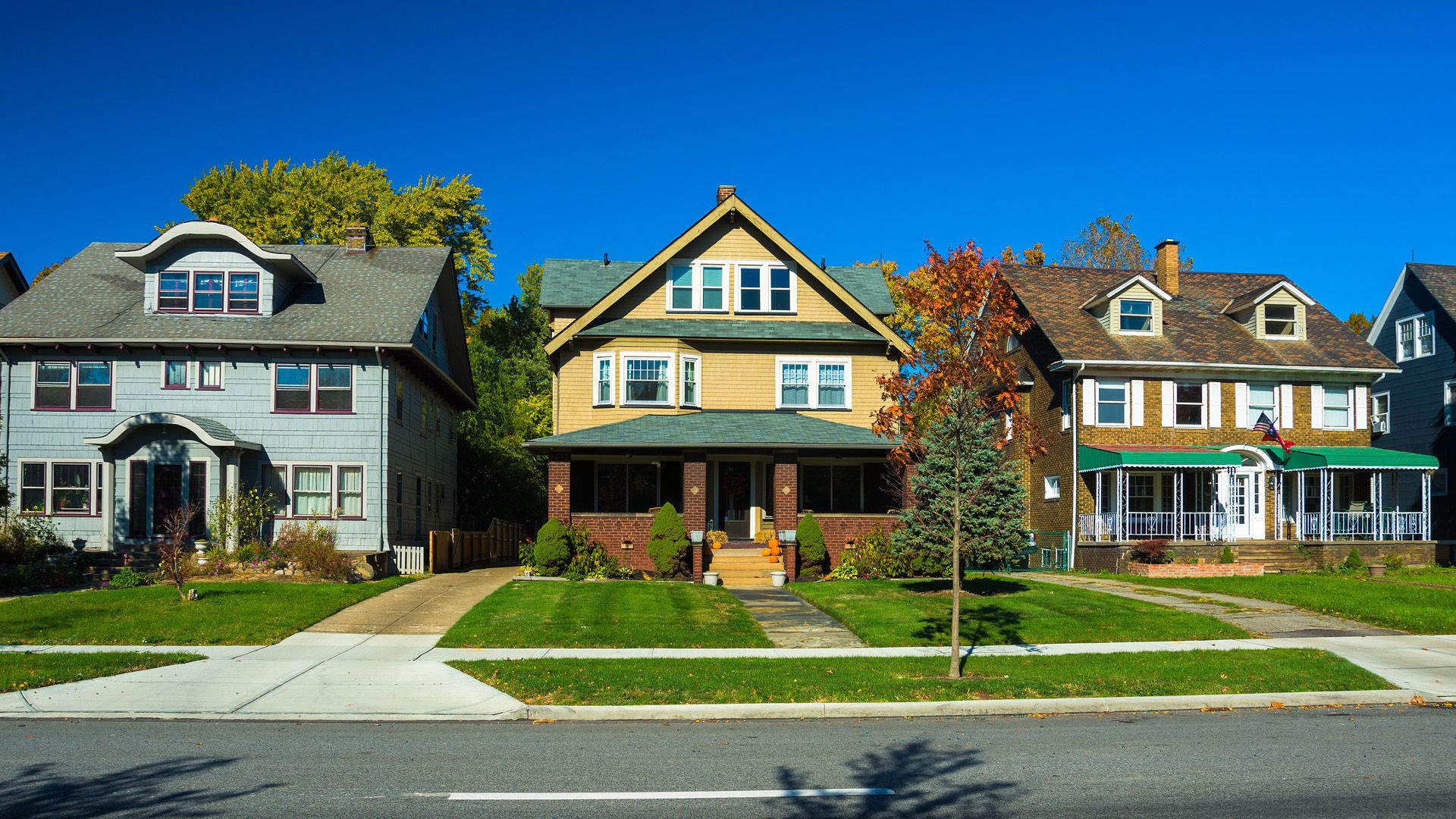 Several houses on a suburban street.