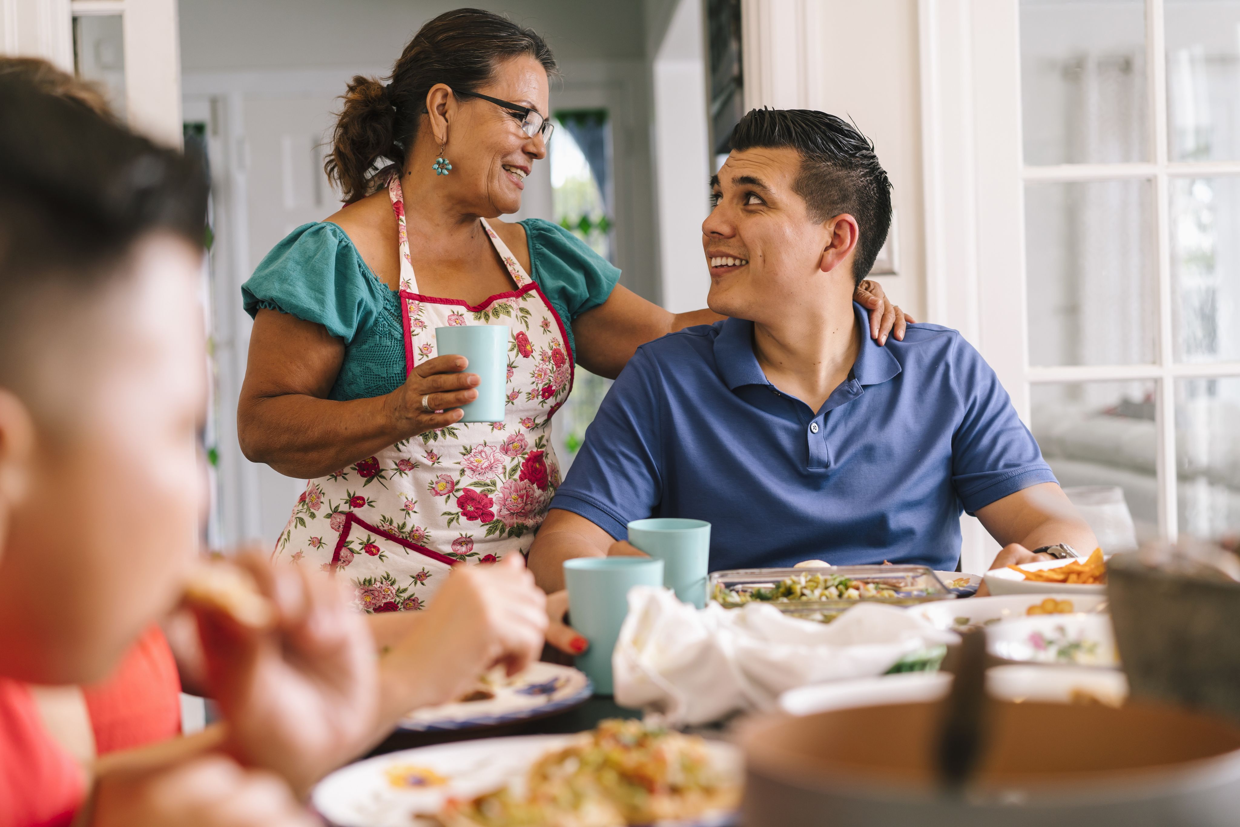 2022 Facts for Features: A Family Shares a Meal Together