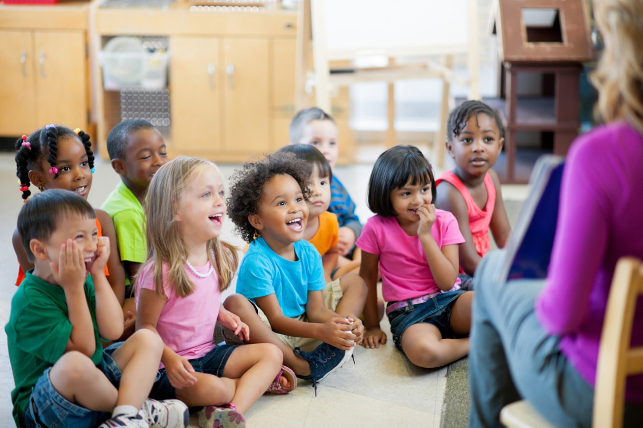 Photo:  Kindergarten students and teach in classroom