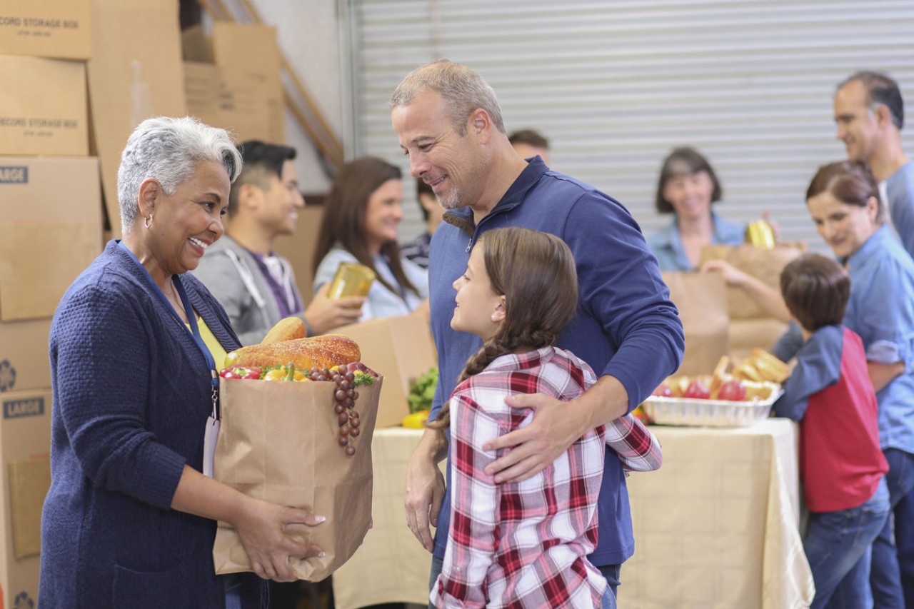 Photo: Poverty - People picking up food at a food bank